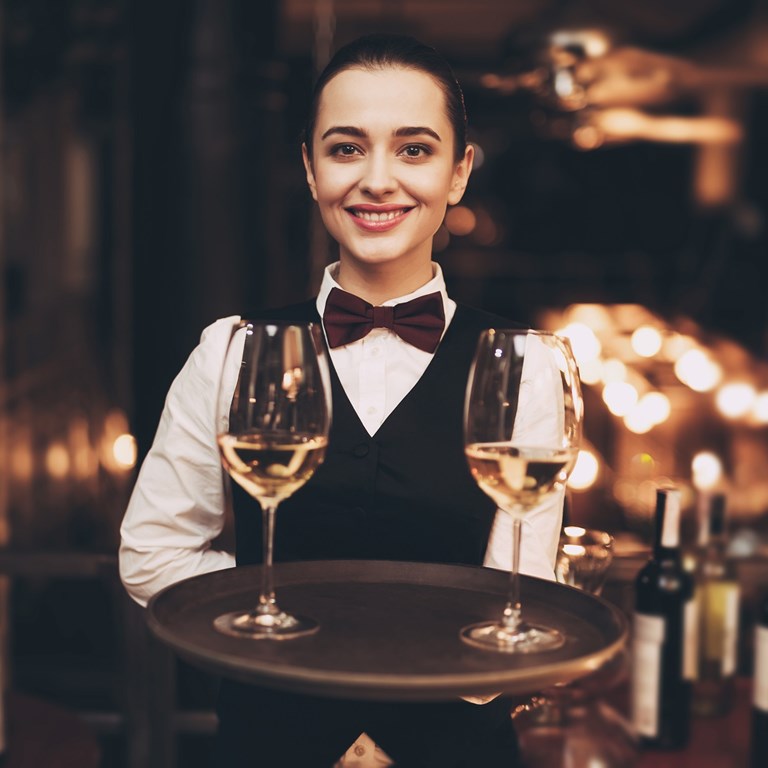 Klein Joyful Waitress Holding Tray With Glasses Of White Wine