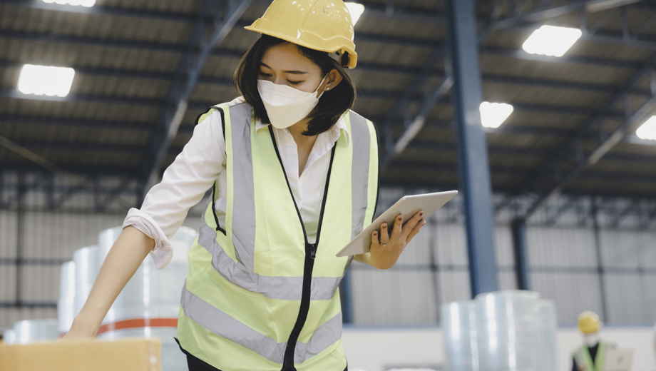 103 Factory Woman Staff Medical Face Mask Protective Safety Using Digital Tablet Working Checking Inventory Storage Textile Warehouse