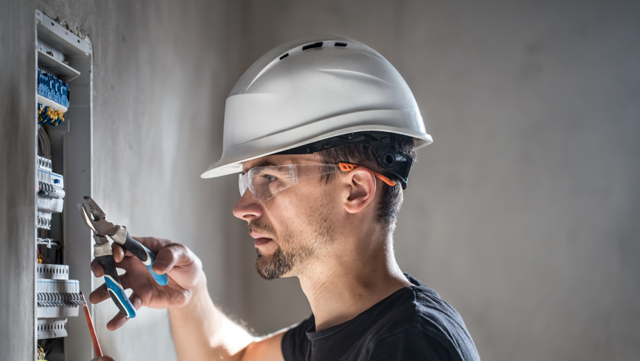 28 Man Electrical Technician Working Switchboard With Fuses Installation Connection Electrical Equipment